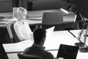 Businesswoman using laptop at work photo