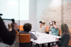 startup business team using virtual reality headset photo