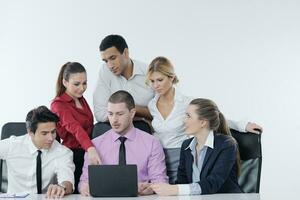 Group of young business people at meeting photo