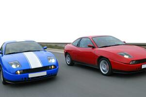 Isolated tuning cars racing on highway photo