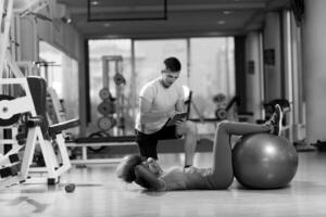 pilates  workout with personal trainer at gym photo