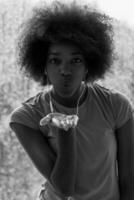 portrait of young afro american woman in gym while listening music photo