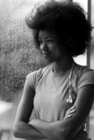 portrait of young afro american woman in gym while listening music photo