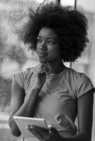 african american woman using tablet photo