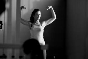 young woman with strong arms photo