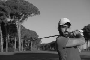 golf player hitting shot photo