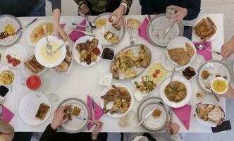 Top view of muslim family having Iftar during Ramadan holy month photo