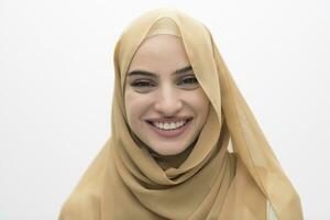 Portrait of young muslim woman wearing hijab on isolated white background photo