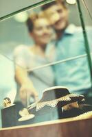 happy young couple in jewelry store photo