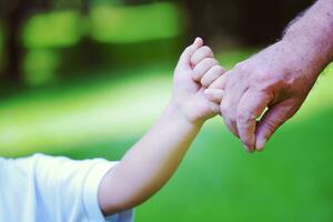 happy grandfather and child in park photo