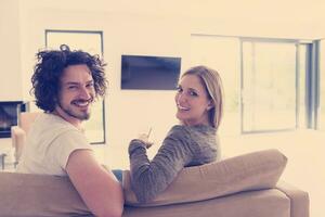 Rear view of couple watching television photo