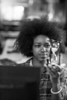 portrait of a young successful African-American woman in modern office photo