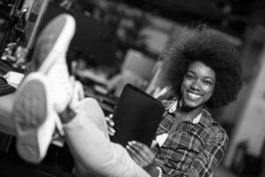 portrait of a young successful African-American woman in modern office photo