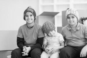 boys with cardboard boxes around them photo