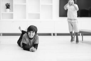 boys having fun with an apple on the floor photo