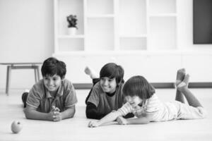 boys having fun with an apple on the floor photo