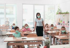 Preschool education. Students at school play interesting games with the teacher for the purpose of education photo