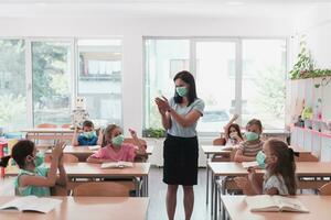 Preschool education. Students at school play interesting games with the teacher for the purpose of education photo