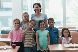 Portrait of children in a preschool institution with their teacher in a torn classroom. Selective focus photo