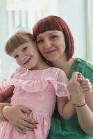 Portrait of a mother and daughter in a modern institution for preschool education photo