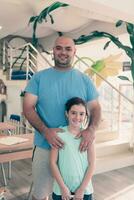 Portrait of a father and daughter in a modern preschool education institution photo