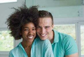 multiethnic couple hugging photo