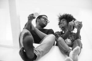 couple having break during moving to new house photo