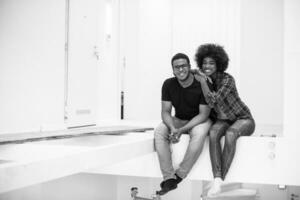 couple having break during moving to new house photo