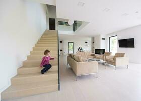 family with little girl enjoys in the modern living room photo