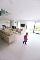 family with little girl enjoys in the modern living room photo