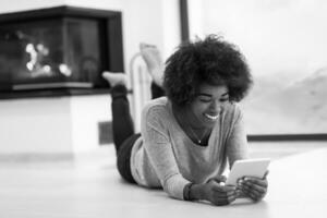 black women used tablet computer on the floor photo