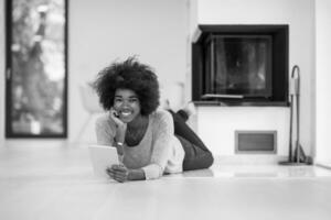 black women used tablet computer on the floor photo