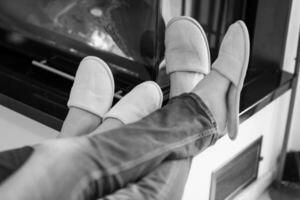 Young couple  in front of fireplace photo