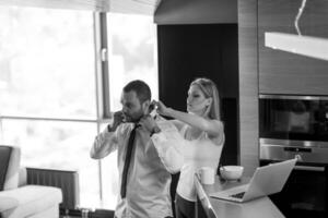 A young couple is preparing for a job and using a laptop photo