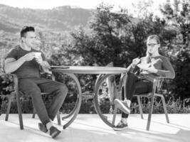 couple enjoying morning coffee and breakfast photo