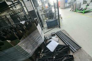 Final stage CNC material. Metal products after processing on CNC machines stand on pallets ready for transport photo