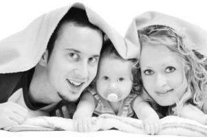 happy young family together in studio photo