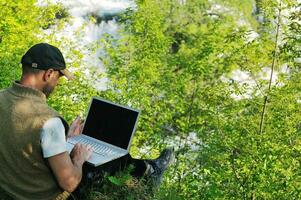 man outdoor laptop photo