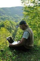 man outdoor laptop photo