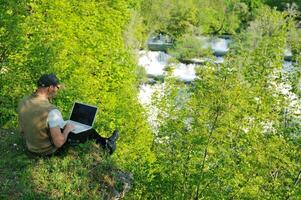 man outdoor laptop photo