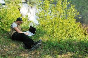 man outdoor laptop photo