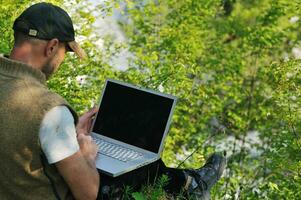 man outdoor laptop photo