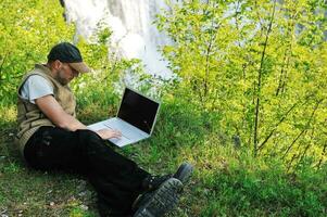 man outdoor laptop photo