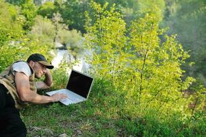 man outdoor laptop photo