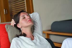 happy young woman relax at home on sofa photo