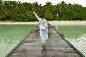 young woman relax on cloudy summer day photo