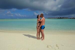 happy young  couple at summer vacation have fun and relax at beach photo
