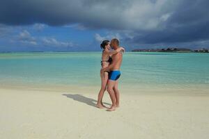 happy young  couple at summer vacation have fun and relax at beach photo