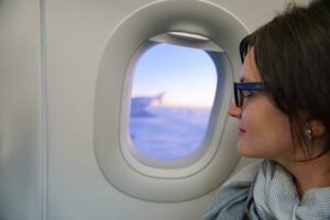 woman in airplane travel photo