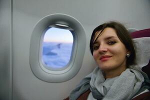 woman in airplane travel photo